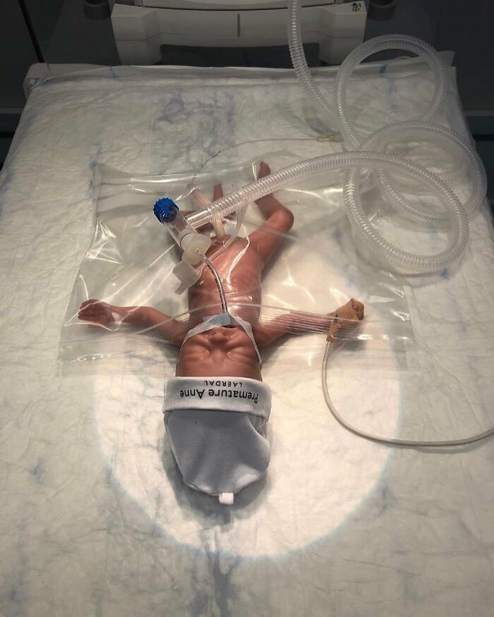 Premature infant connected to breathing tubes inside a medical incubator, illustrating moments when medicine crossed into the uncanny.