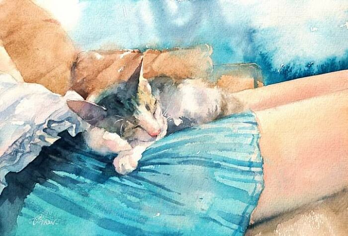 Watercolor cat art showing a sleeping cat curled up on a person's lap in soft blue and warm tones.