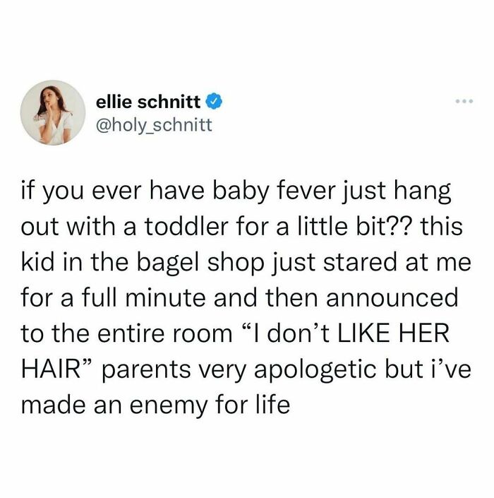 Tweet about a toddler humorously declaring dislike for someone's hair, showcasing hilariously random posts to brighten your day.