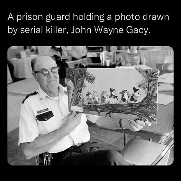 Prison guard holding disturbing photo drawn by serial killer John Wayne Gacy, highlighting unsettling events that actually happened.