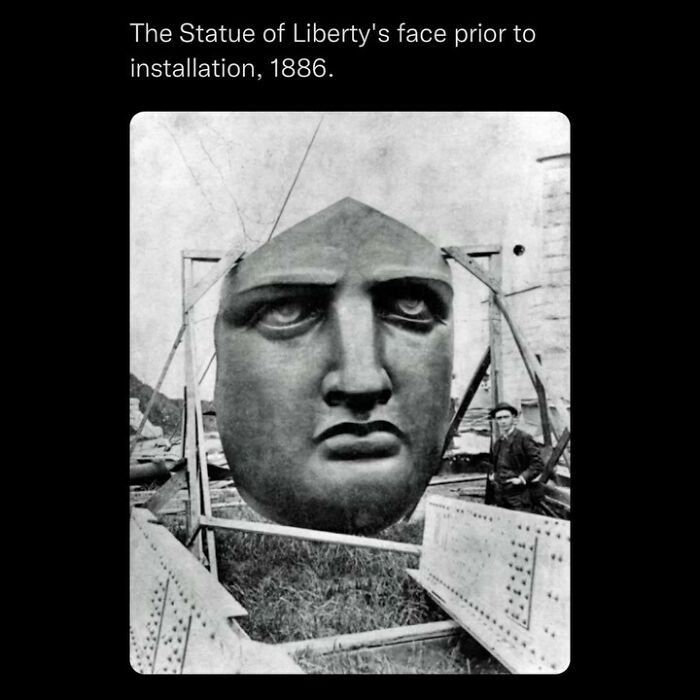 Large face of the Statue of Liberty before installation in 1886, highlighting disturbing and unsettling events in history.