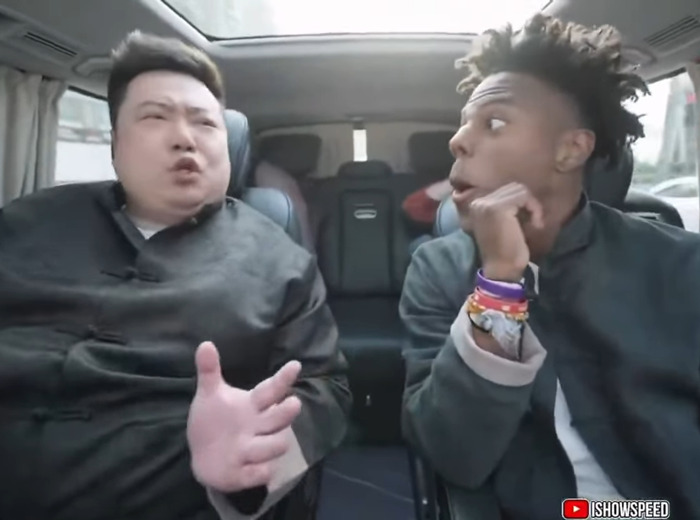 Chinese TikToker performing viral impression of U.S. President inside a car with a surprised passenger beside him.