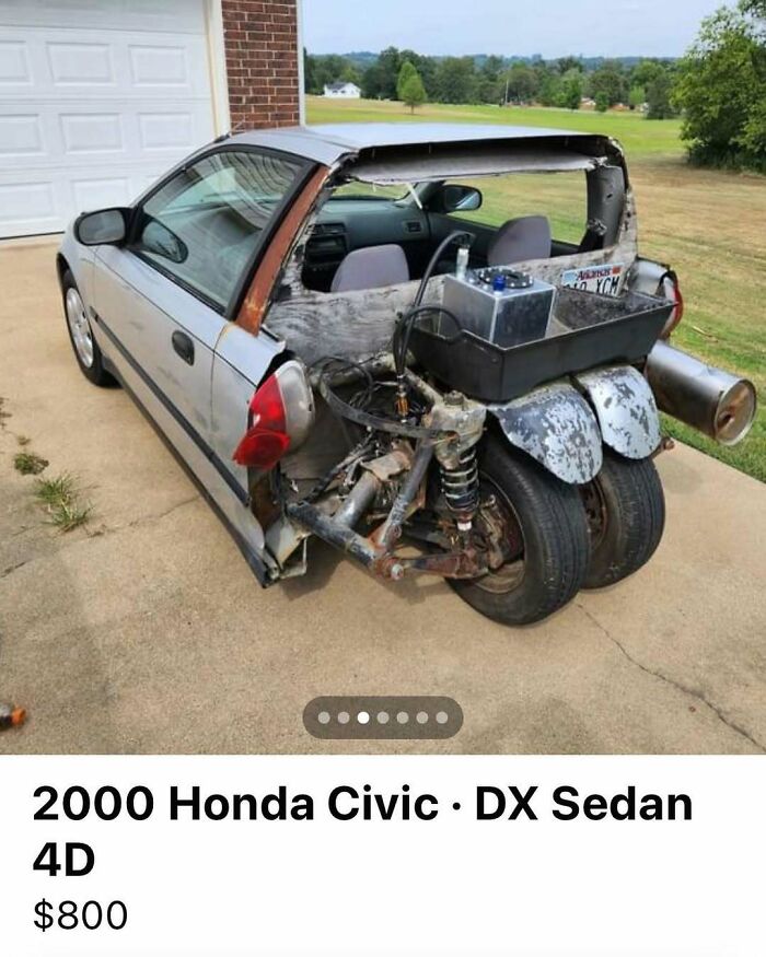 Damaged 2000 Honda Civic with chaotic rear end modifications, missing bumper, and exposed frame for sale.