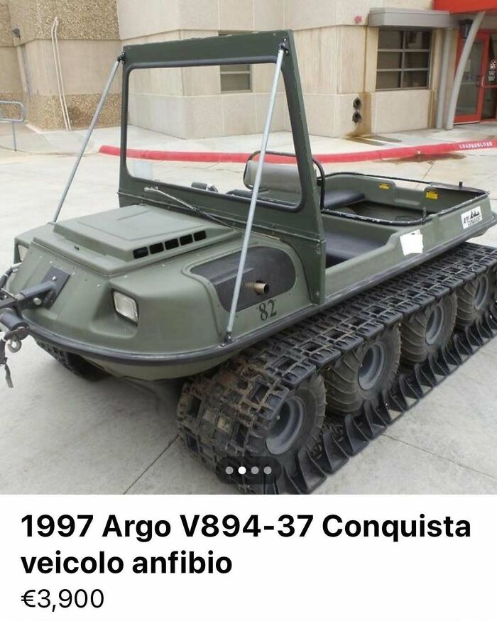 Military-style amphibious vehicle with tank-like tracks and open cabin, featured among cars of chaos for sale.
