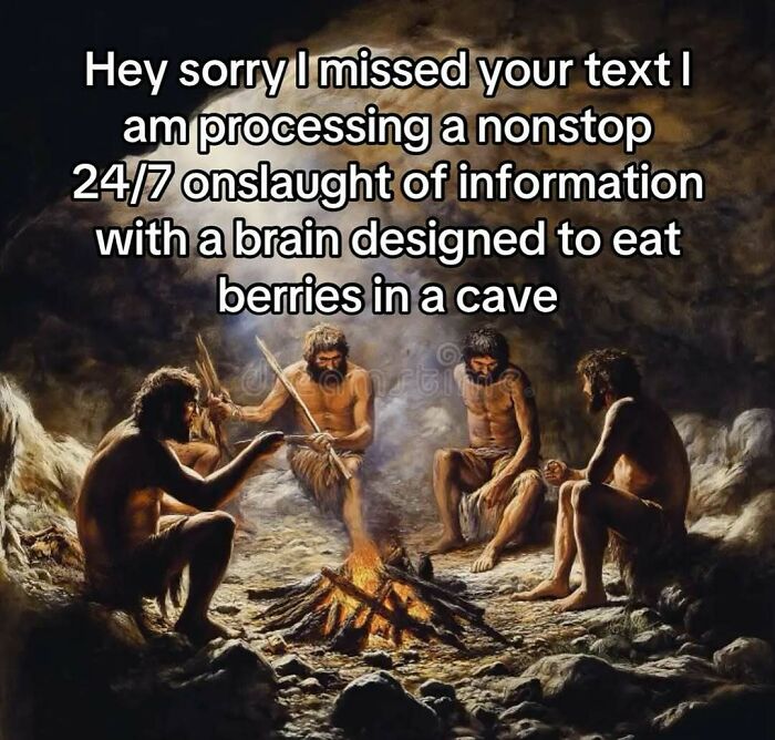 Humorous meme showing cavemen by fire with text about processing nonstop information and brain limits.