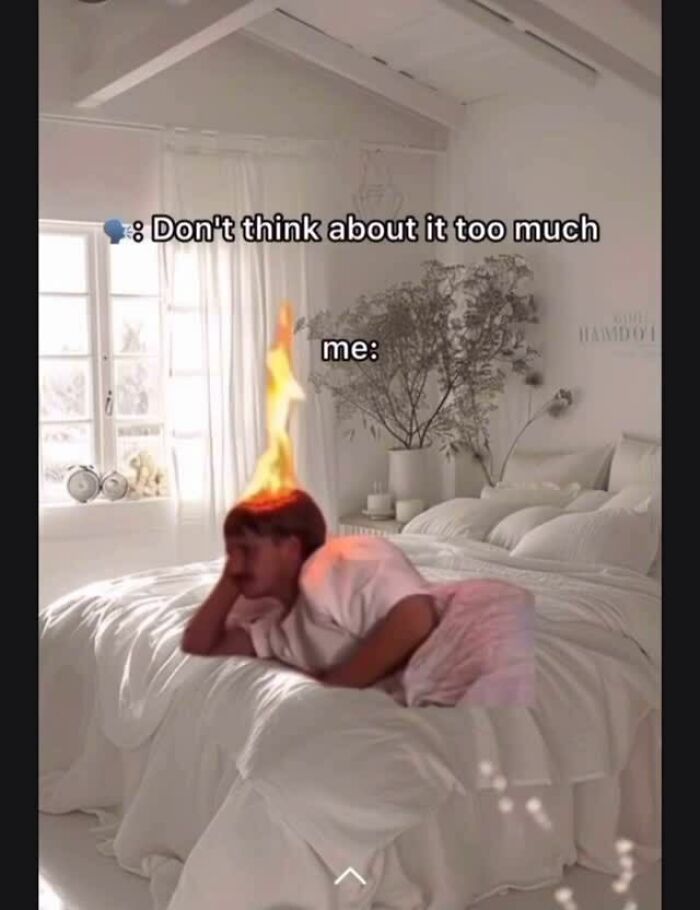 Person lying on bed with head on fire, overlaid text about overthinking, illustrating relatable memes for avoiding responsibilities.