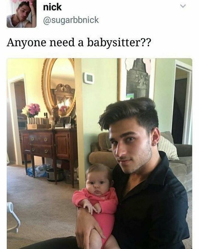 Young man holding a baby inside a living room, sharing cringey pictures from Instagram with a humorous caption.