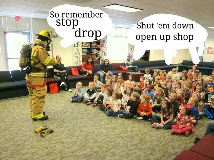 Firefighter teaching children fire safety with nostalgic ’90s meme text stop drop and shut em down in classroom setting