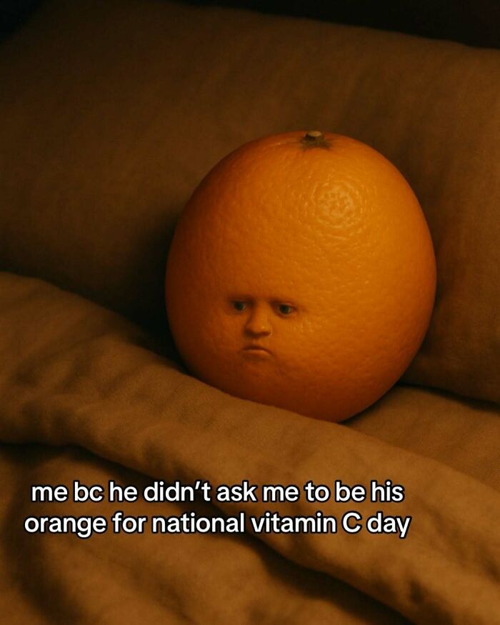 Orange with a human face looking sad on a couch, a silly relatable meme about National Vitamin C Day.