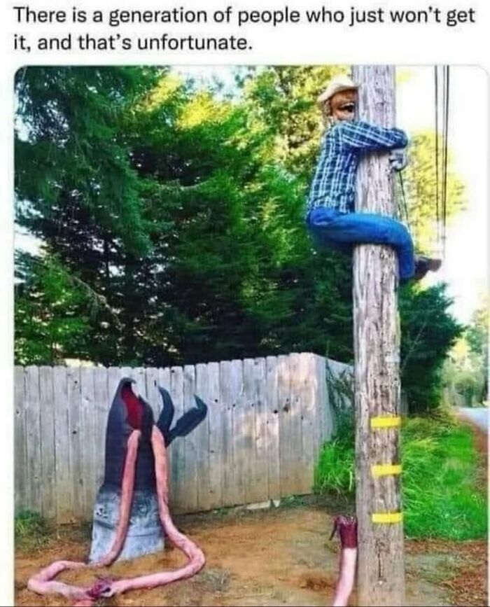 Man climbing a pole next to a large exaggerated fake worm, nostalgic ’90s posts and memes humor about generations.