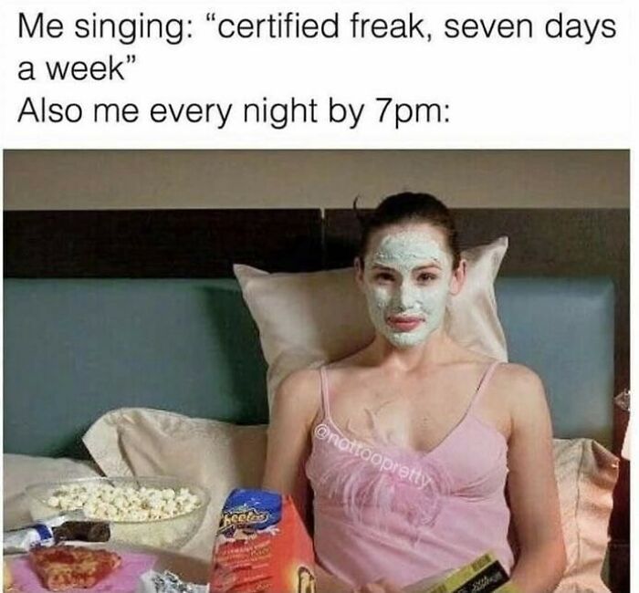 Woman with a facial mask lounging in bed eating snacks, illustrating memes for days about avoiding responsibilities.