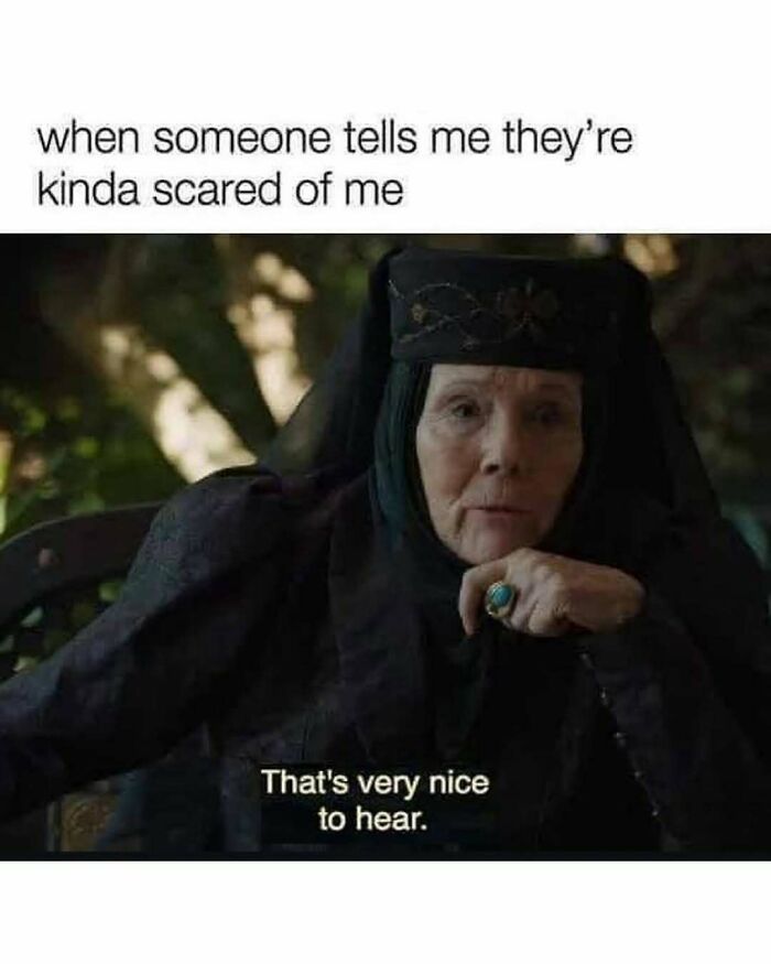 Older woman in medieval costume sitting and smiling with text about being scared, reflecting millennial mind memes on Instagram.