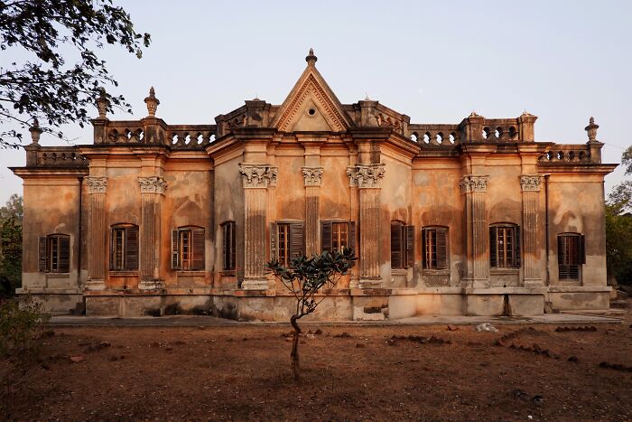 Simultala historic building with detailed architecture surrounded by dry land, representing timeless escape from the modern world