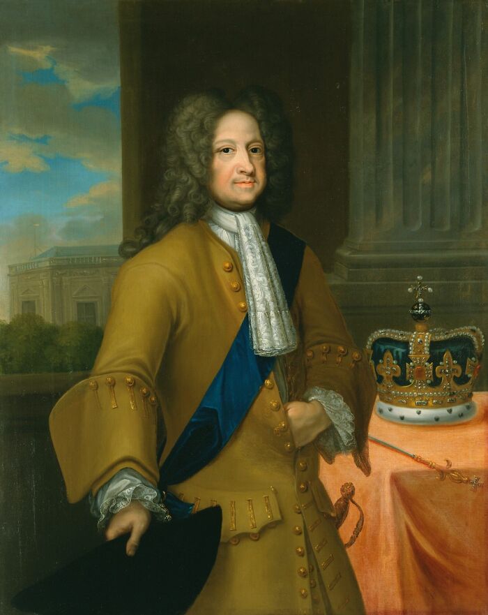 Portrait of a royal figure in historical attire standing beside a crown, illustrating surprising facts about royals.