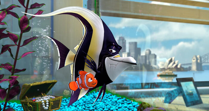 Animated fish characters inside a colorful aquarium illustrating unconventional crushes in a unique underwater setting.