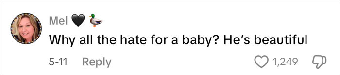 Screenshot of a social media comment defending ET's baby against online bullying, highlighting support for the child.