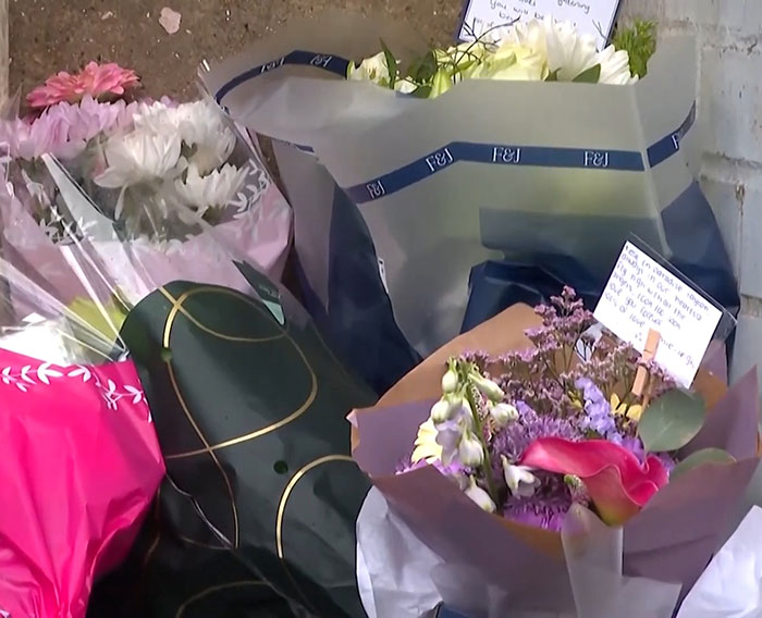 Floral tributes placed at a memorial site after a missing boy's body was found in an industrial park fire. Floral tributes placed at a memorial site after a missing boy's body was found in an industrial park fire.