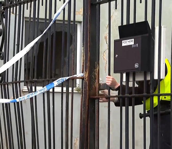 Police tape surrounds industrial park gate as investigation continues after missing boy's body found in fire and 14 children arrested. Police tape surrounds industrial park gate as investigation continues after missing boy's body found in fire and 14 children arrested.