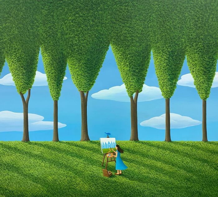 Woman in blue dress painting calming artwork outside among tall shaped trees under a blue sky with clouds.