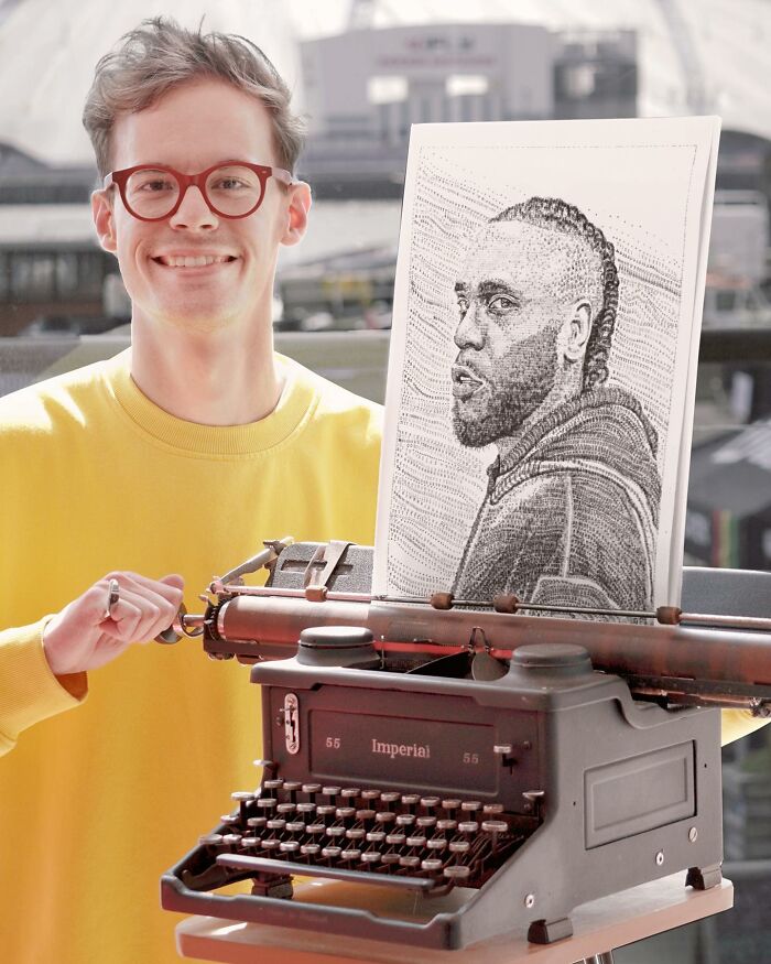 Young artist displaying impressively detailed portrait drawn with a vintage typewriter outdoors.
