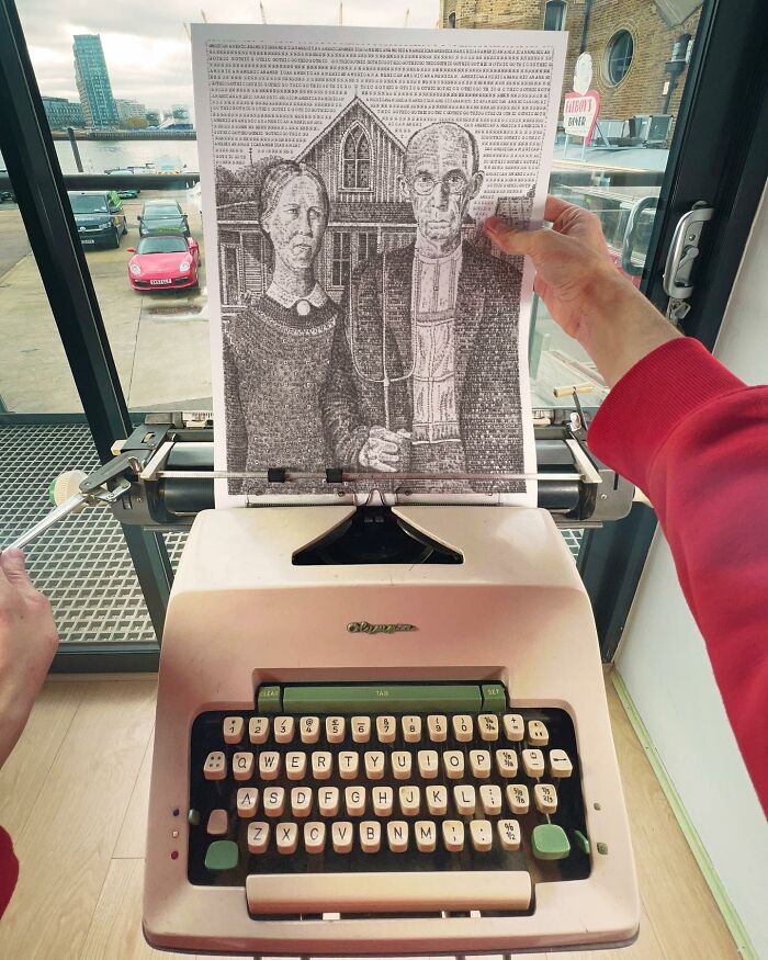 Young artist creating detailed typewriter drawings, holding a paper with an intricate portrait above a vintage typewriter.