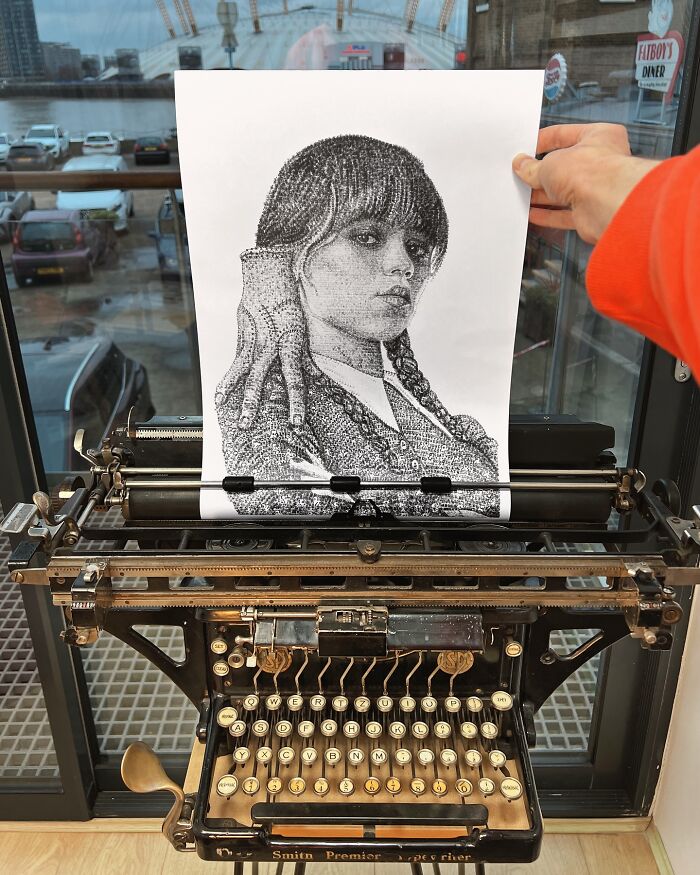 Young artist creates detailed portrait art using a vintage typewriter with impressive skill and precision.