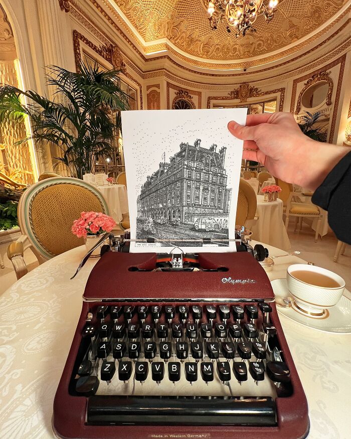 Young artist drawing detailed building image with a vintage typewriter in an ornate elegant room setting.