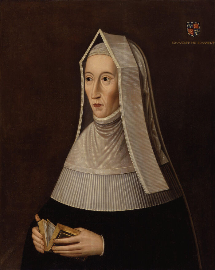 Portrait of a royal figure in historical attire holding a book, illustrating surprising facts about royals in history.
