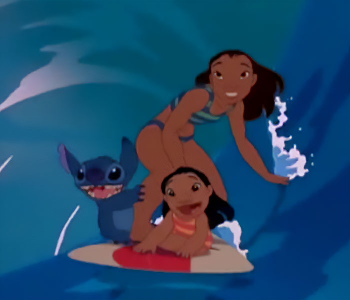 Lilo and Stitch surfing together with smiles, capturing the original Disney characters in an animated ocean scene.