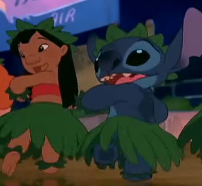 Animated scene of Lilo and Stitch dancing in grass skirts, highlighting Disney fans' reaction to character look changes.