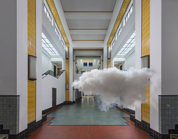Indoor space featuring a realistic cloud art installation created using a combination of smoke and water vapor.