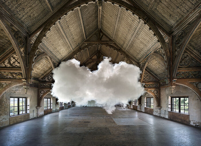 Indoor space with realistic clouds created using a combination of smoke and water vapor art installation.