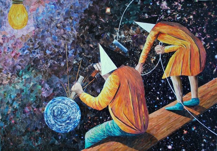 Abstract paper art showing two figures with cone hats in orange clothing working on a colorful celestial scene with a glowing planet.