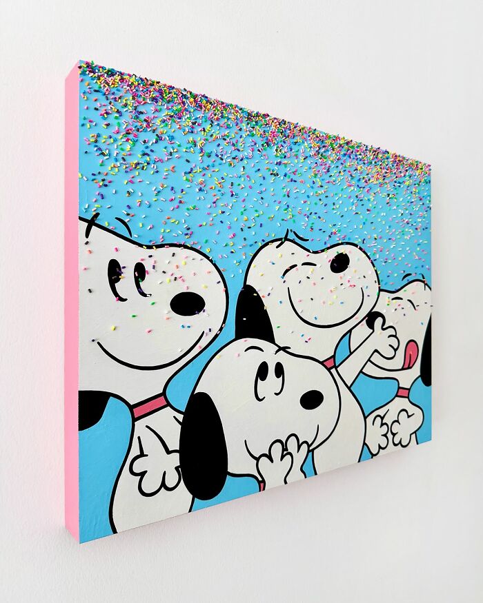 Art piece of cartoon dogs covered in colorful sprinkles on a blue background, showcasing unique sprinkle artwork by Pepe Bratanov.