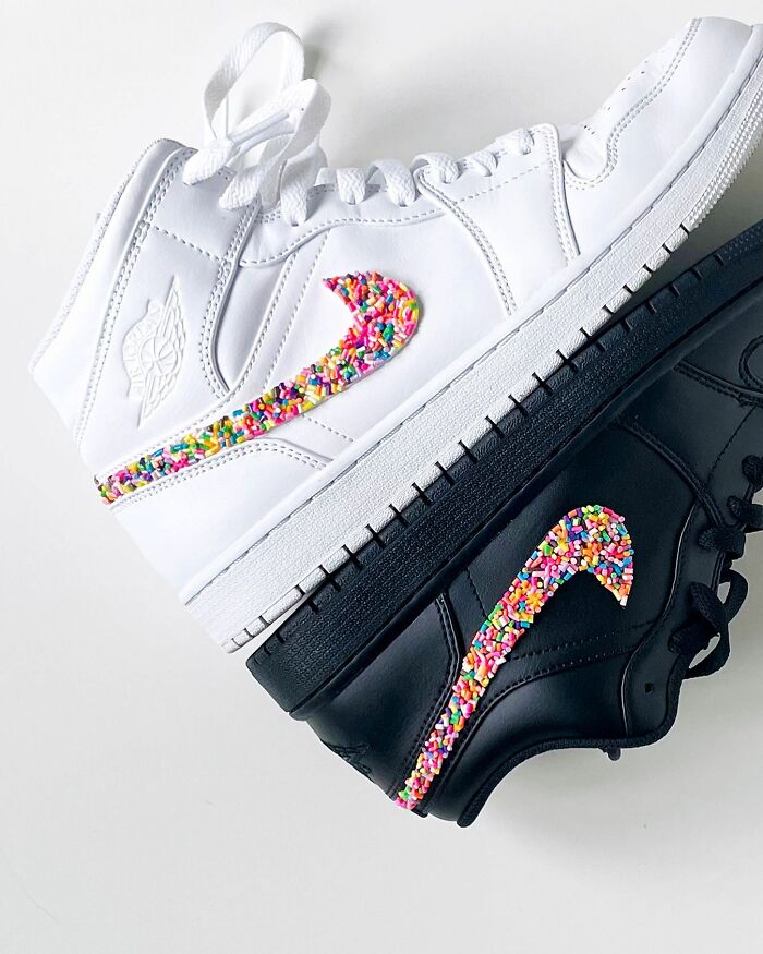 White and black sneakers with Nike swoosh logos covered in colorful sprinkles as unique artwork by Pepe Bratanov.
