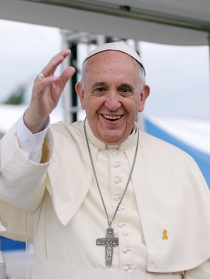 Pope smiling and waving during public appearance, representing notable people who passed away in 2025.