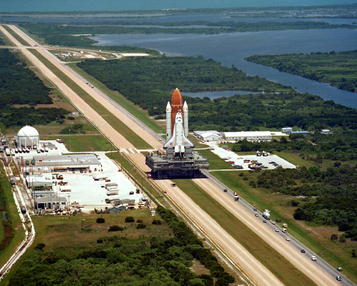 Space shuttle being transported on a road at a launch site, illustrating one of the biggest mistakes that changed history.