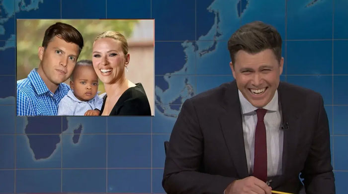 Comedian on SNL desk laughing during a segment about Scarlett Johansson and husband getting revenge. Comedian on SNL desk laughing during a segment about Scarlett Johansson and husband getting revenge.