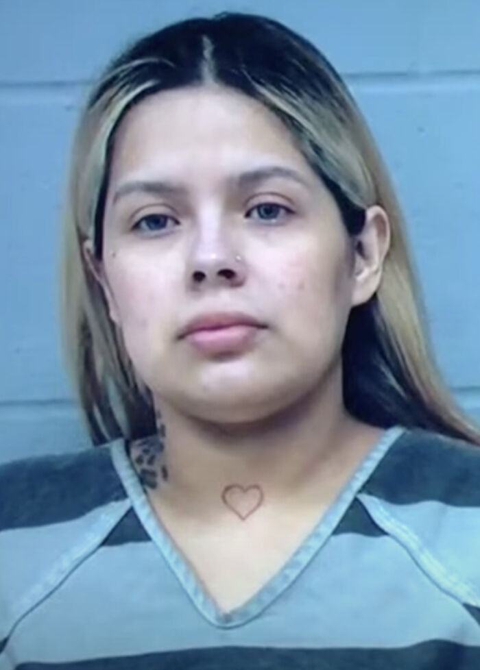 Mugshot of a woman with a heart tattoo on her neck, related to the 7YO girl found in a closet case. Mugshot of a woman with a heart tattoo on her neck, related to the 7YO girl found in a closet case.