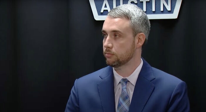 Man in a blue suit and plaid tie giving a statement about a 7-year-old girl found in a closet during a missing sister search. Man in a blue suit and plaid tie giving a statement about a 7-year-old girl found in a closet during a missing sister search.