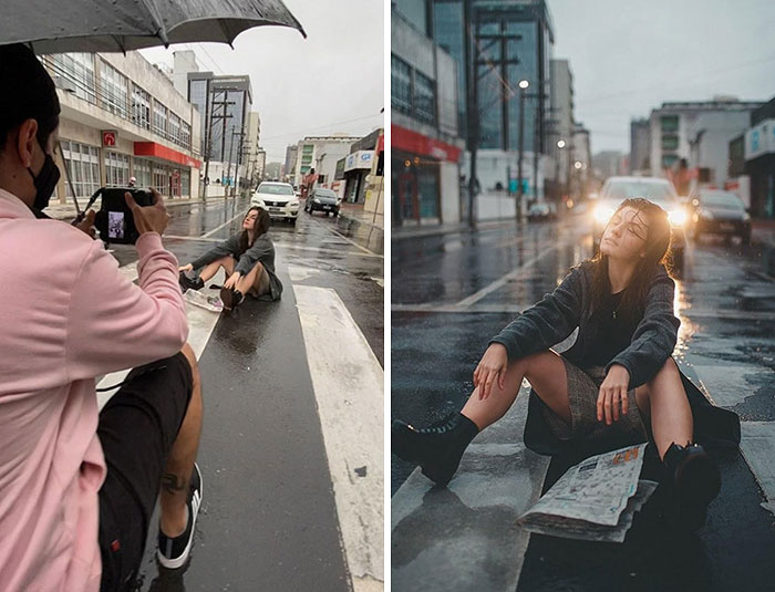 Photographer capturing behind the scenes moment of a woman sitting in the rain on a city street for creative photoshoot.
