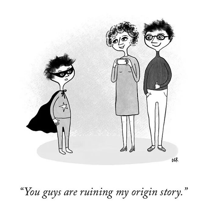 One-panel comic by Dahlia Gallin Ramirez showing a child in superhero costume frustrated with two adults taking photos.