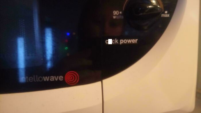 Close-up of microwave controls showing quick power settings and intellowave logo on a household appliance.