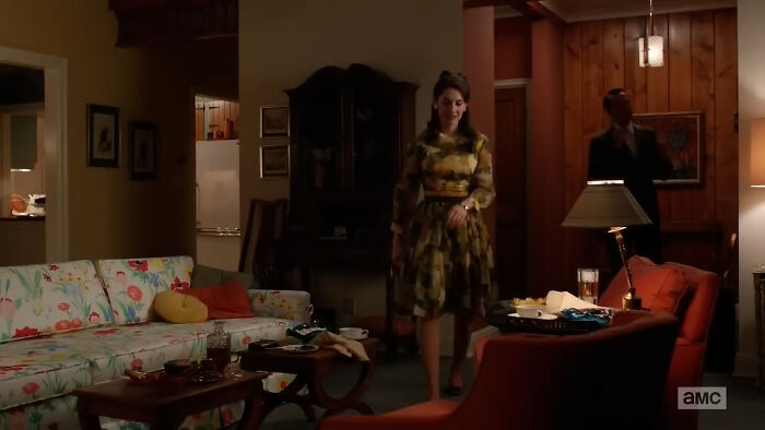 Scene from a movie set featuring actors in a vintage living room, illustrating horrifying behind-the-scenes facts.