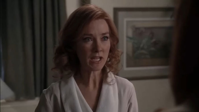 Actress known for Desperate Housewives and Young Sheldon scene, expressing emotion indoors with soft lighting.