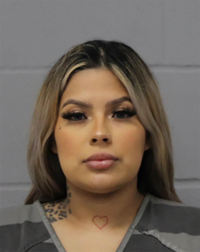 Woman in jail attire with tattoos, linked to case of mom who locked 7YO starving child in closet and never reported missing 2YO.