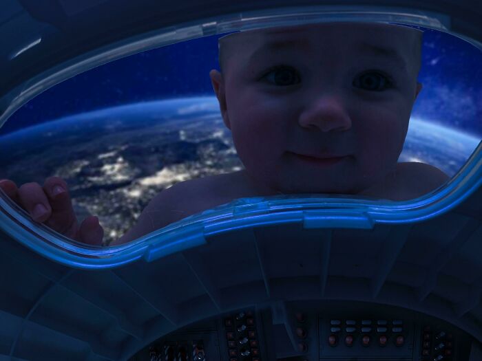 Baby photoshopped inside a spaceship window with Earth in the background, showcasing hilarious Photoshop skills.