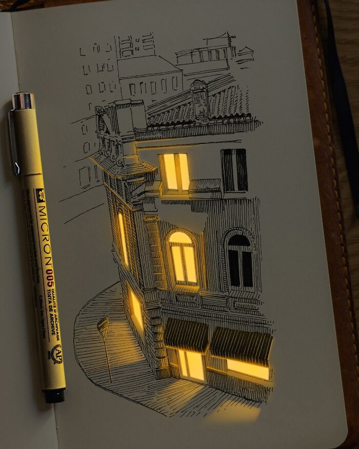 Pen and ink drawing of a building with glowing windows, showcasing a Ukrainian artist’s light effect technique.