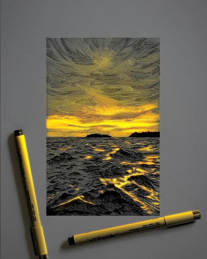 Pen and ink drawing by Ukrainian artist depicting glowing sunset light reflecting on ocean waves with two pens nearby.