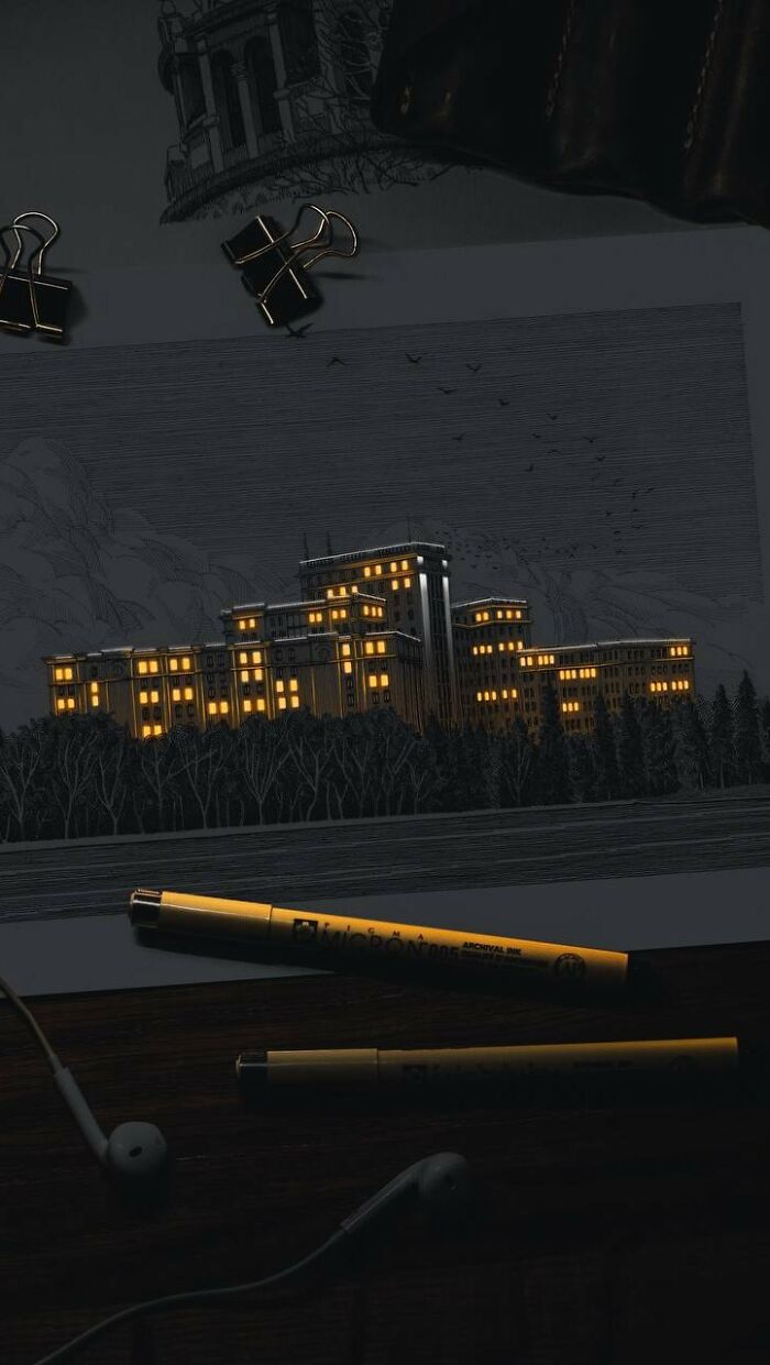 Pen and ink drawing of a glowing cityscape at night by Ukrainian artist with warm light shining through building windows.